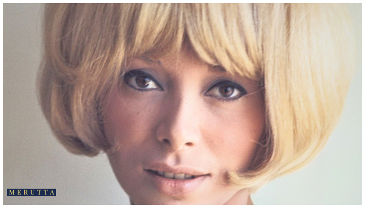 Mireille Darc smiling in a blonde hairstyle — iconic French actress known for grace, femininity, and timeless elegance.