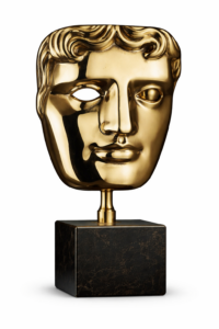 BAFTA mask trophy on a marble base.